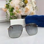 Gucci Grey Metal Mắt Xám Gọng Đen Vàng GG0394S