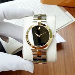 Movado Juro Mặt Đen Viền Vàng Dây Kim Loại Demi 0607443